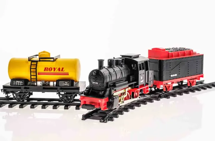 Modelleisenbahn mit 2 Wagons und Gleisen - Bild 1